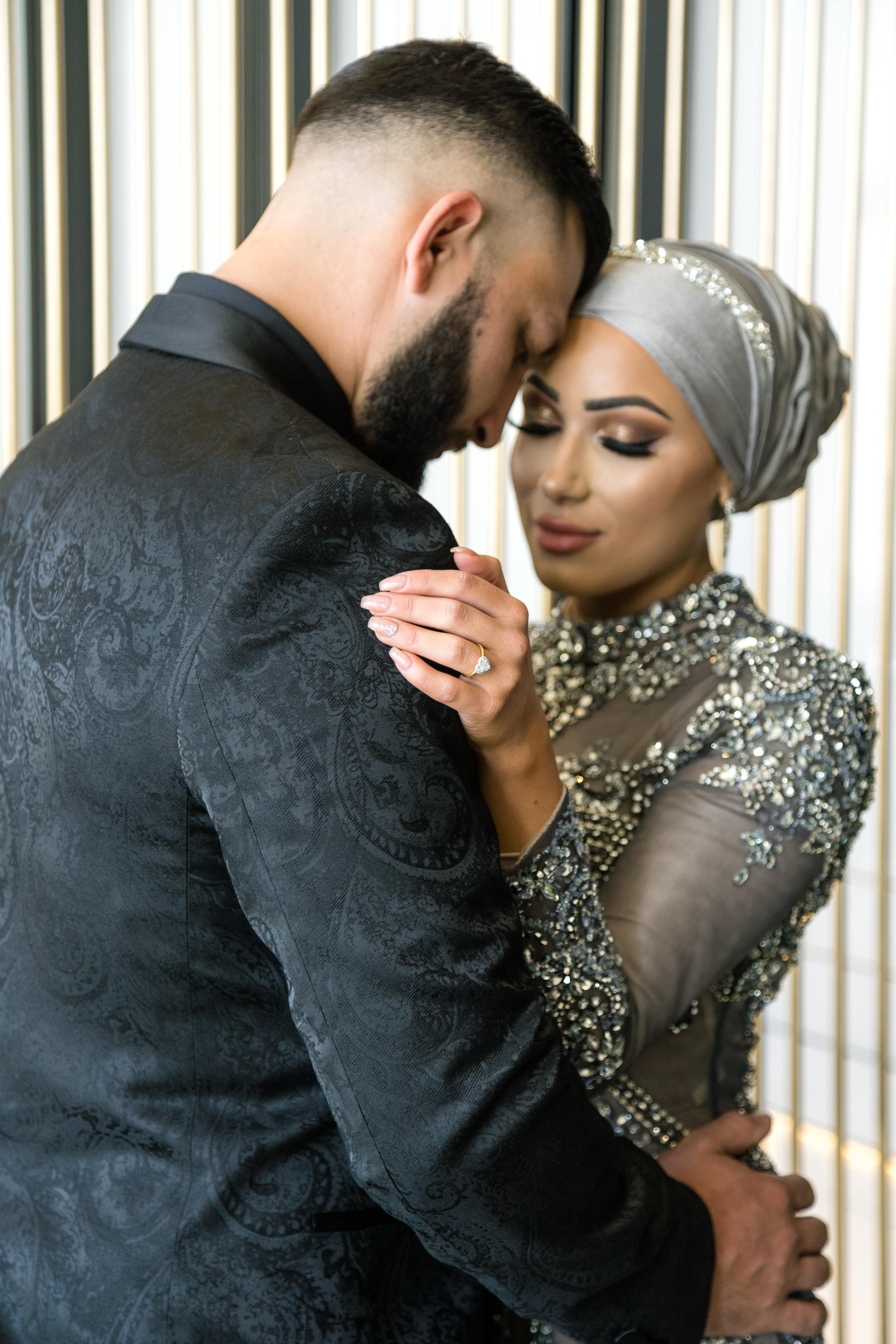 focus on the engagement ring on the bride-to-be's finger